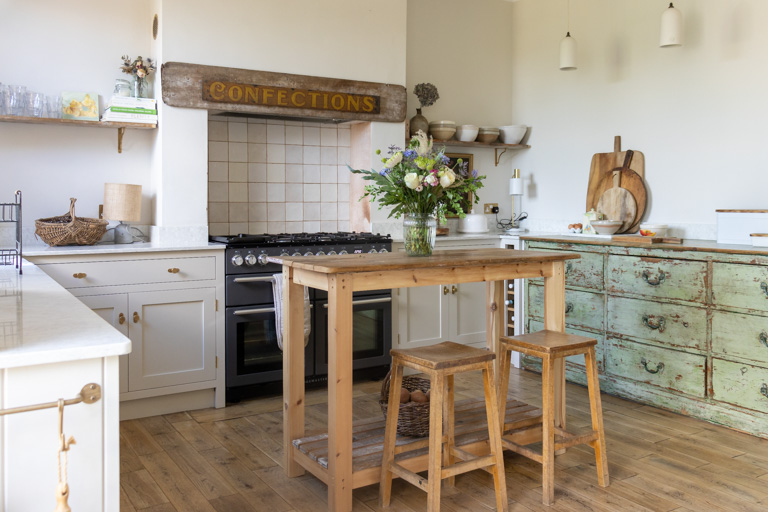 A newly built, shaker style kitchen, built around vintage furniture